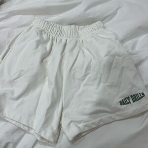 Daily Drills White Sweat Shorts with Green Logo